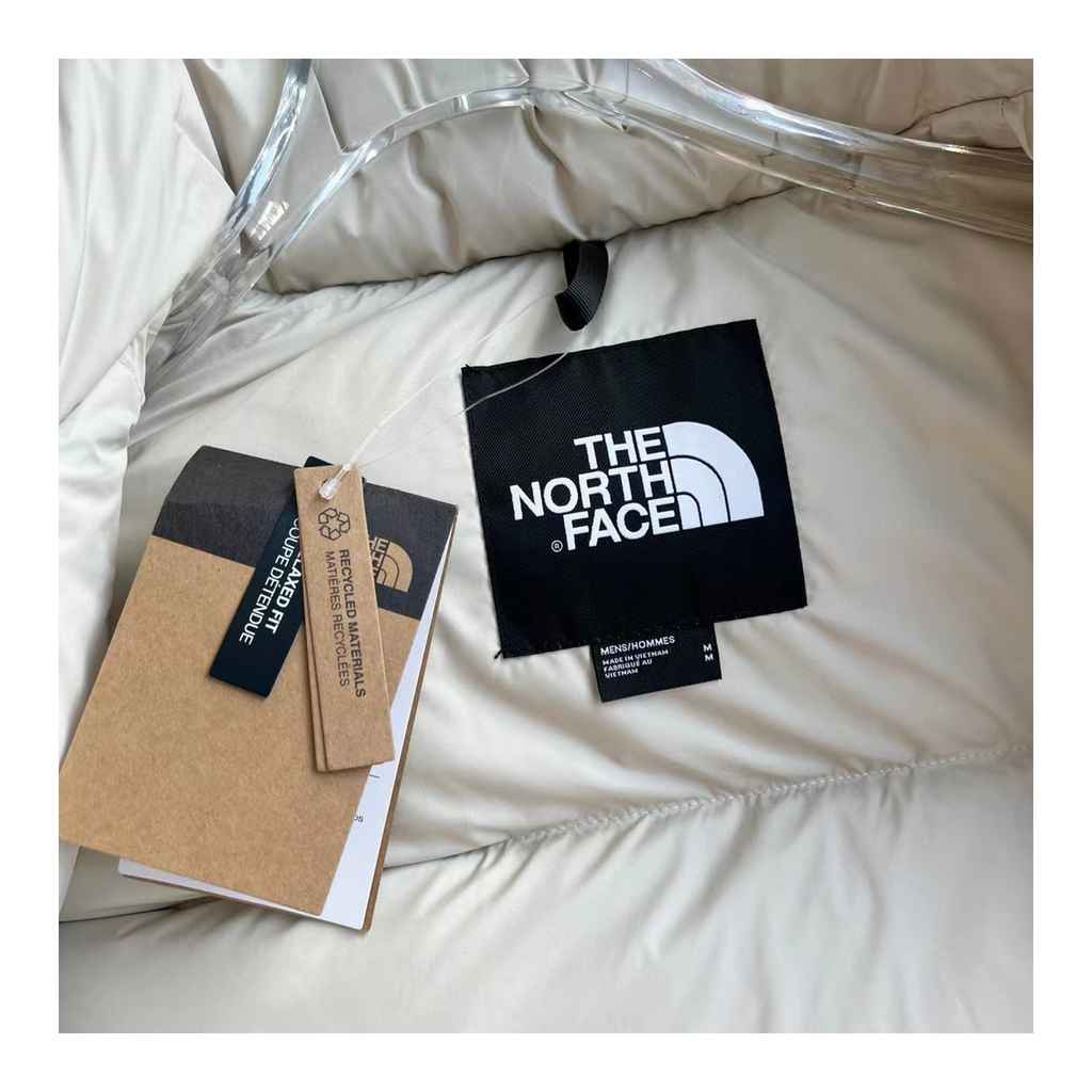 The North Face Cropped Puffer Jacket with Stand Collar in Cream